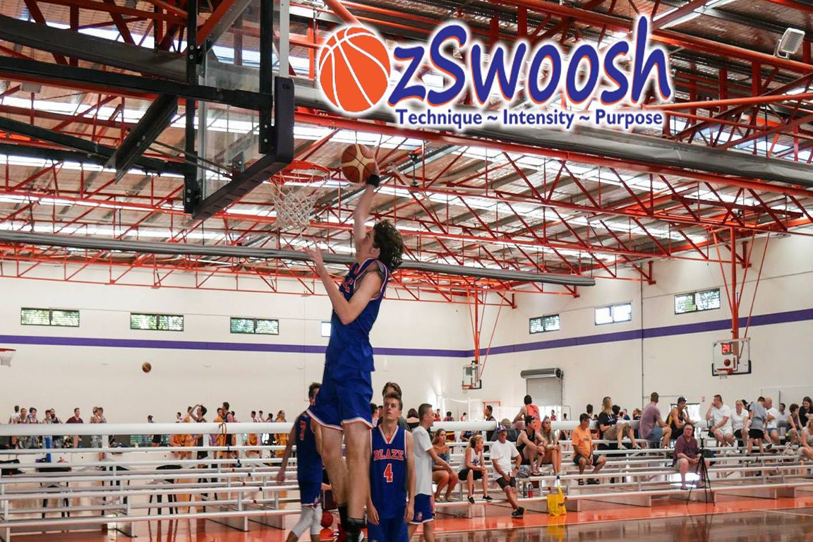 OzSwoosh Basketball Academy athlete Aaron Baigrie (16 years) dunks in warm up at the Oz Day Carnival in 2018